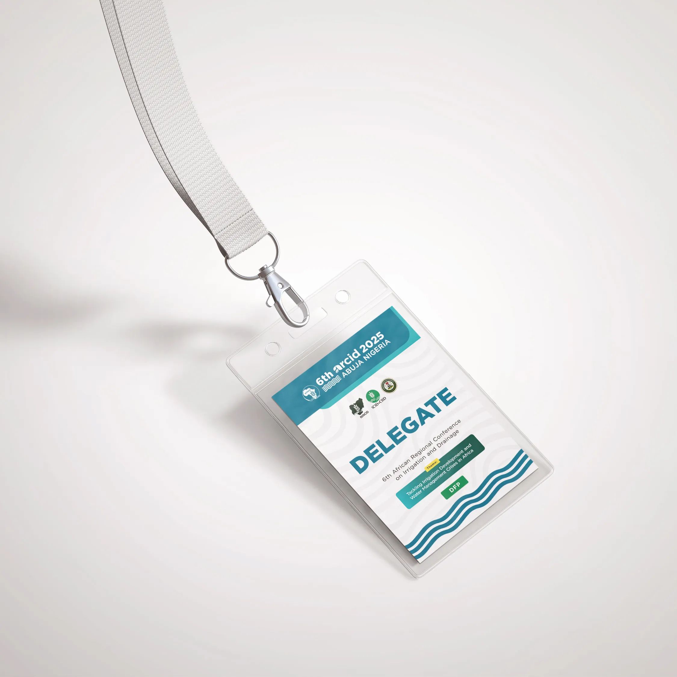 Delegate tag on a lanyard with the conference mark, theme and wave pattern